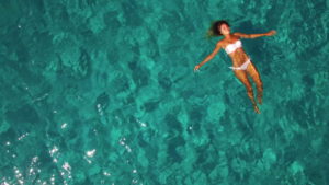 person floating in ocean